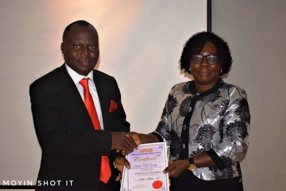 From right, Ambassador Elvis Otobo, receiving induction certification from  Ag. Registrar/Chief Executive, APCON, Ijedi lyoha in Lagos. 